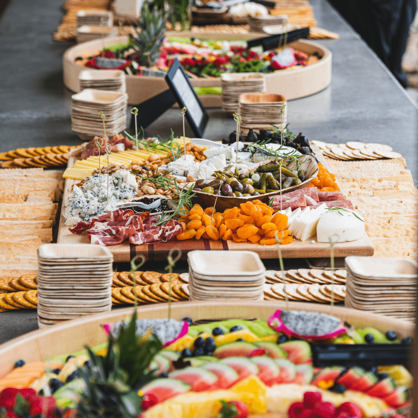 Valley Farm Market catering spread with BBQ, mac and cheese, and roasted vegetables
